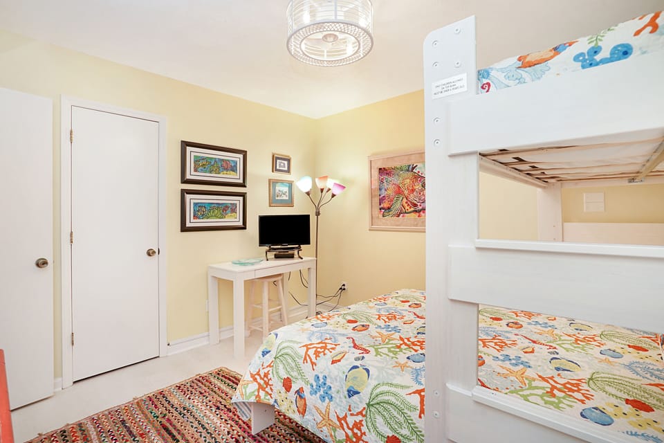 Your children will love the cheerful bunk beds with playful sea-themed bedding and dedicated TV space for cozy movie nights.