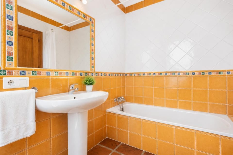 Family bathroom with bath and shower
