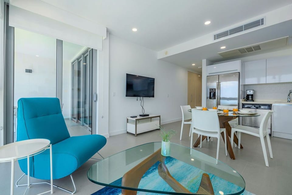 Step into your bright, modern retreat where sleek design meets comfort—your living area flows seamlessly into a fully-equipped kitchen, perfect for relaxing evenings or morning coffee with a view.