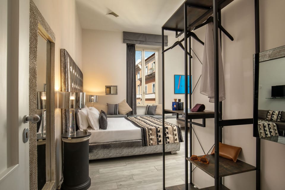 Deluxe Quadruple Room | Minibar, blackout drapes, soundproofing, free WiFi