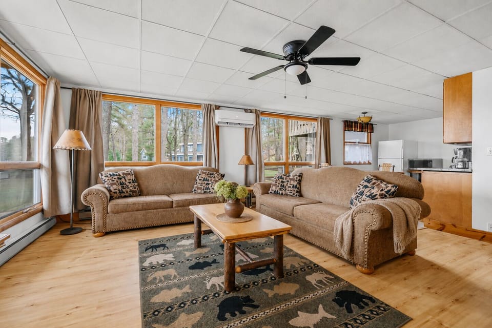 Living Room: Sun-soaked space with beautiful views, perfect for relaxation and family time!