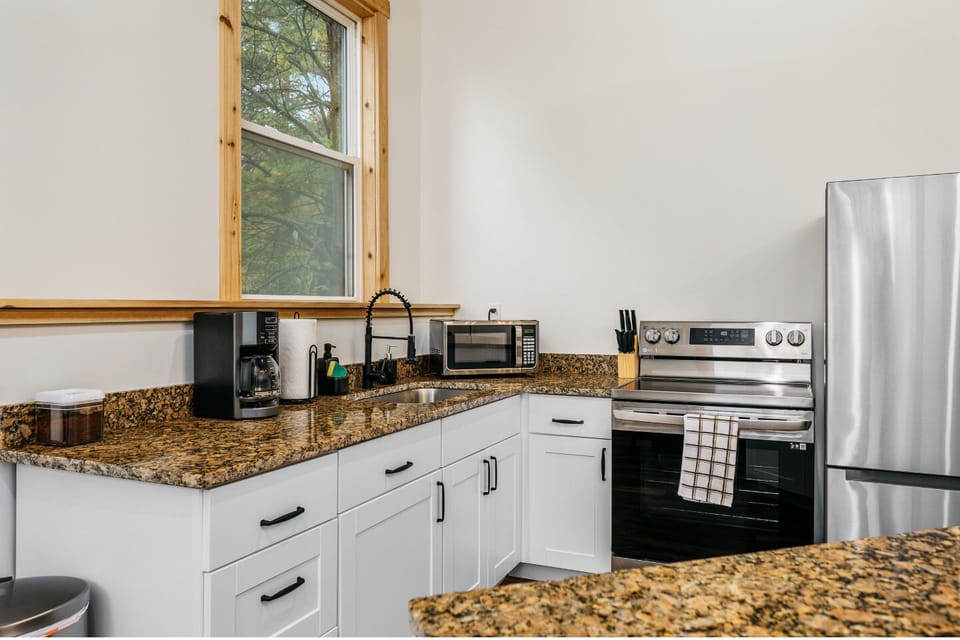 Whip up culinary delights with modern appliances and stunning granite countertops!