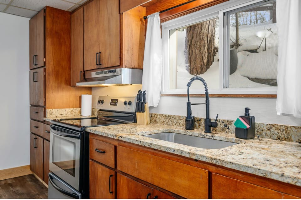 Modern appliances and granite counters create a delightful cooking space with nature views!