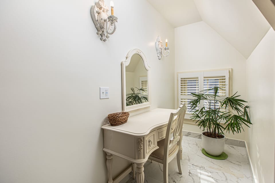Zinnia Room | Bathroom | Jetted tub, rainfall showerhead, designer toiletries, hair dryer