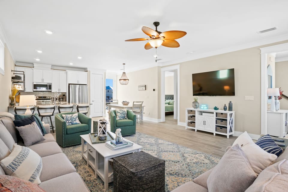 65” tv in living room. Plenty of seating for large group.