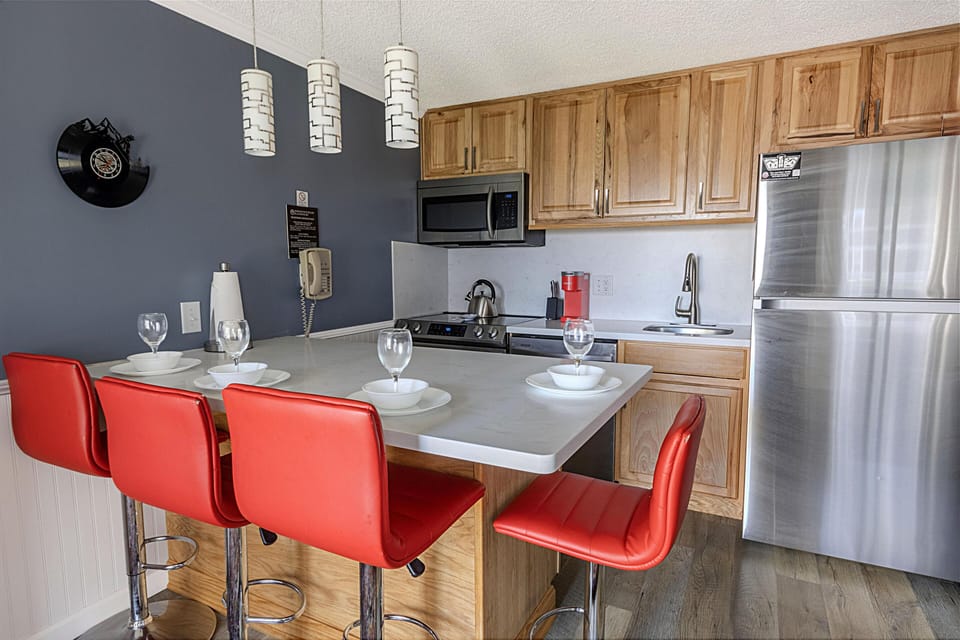 The modern kitchen island comfortably sits four people.