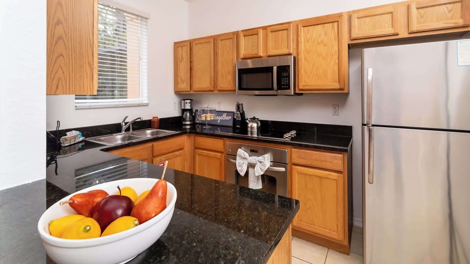 Townhome, Multiple Beds, Hot Tub, Garden View (Orlando's Heartland) | Private kitchen | Fridge, microwave, oven, stovetop