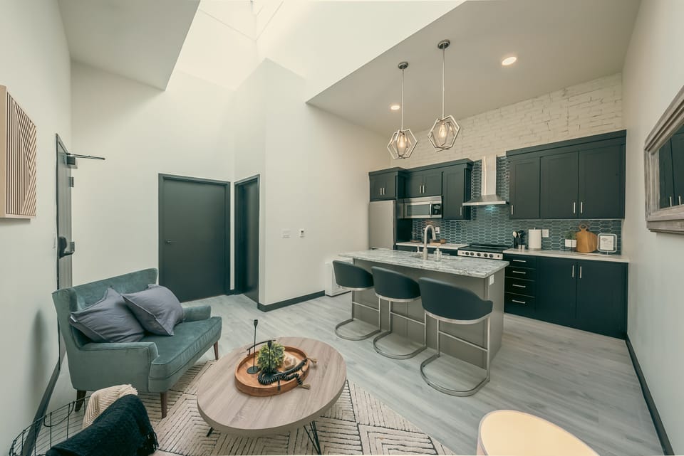 Large living area with island, full kitchen, seating area and a 20 ft skylight!