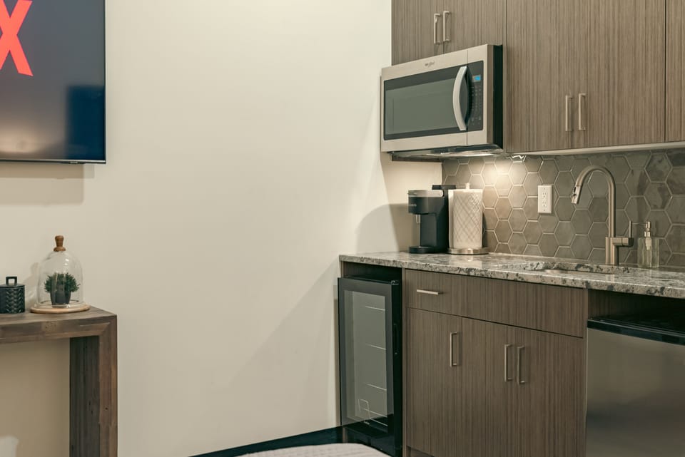 Mini fridge, mini freezer, coffee maker, sink fully stocked cabinets & microwave