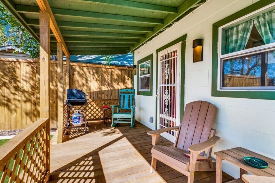 Cozy & covered back cedar porch, with Adirondack porch furniture
