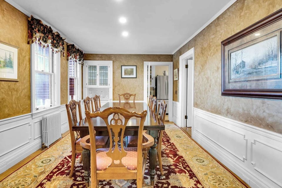 Formal dining room looking toward the built-in china cabinet and kitchen