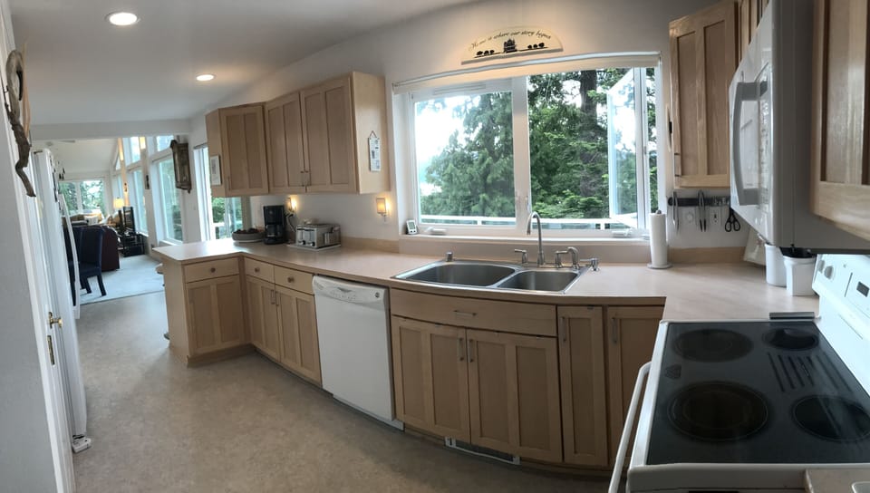 Kitchen with many amenities, spices & cookware to create delicious meals.