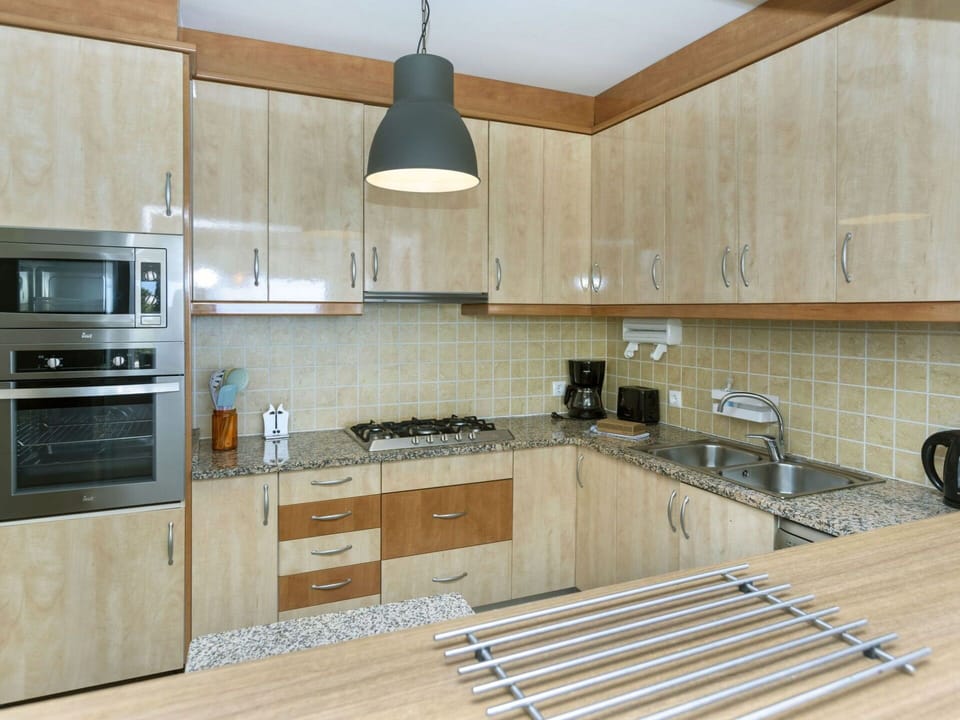 Cabinetry, Countertop, Property, Kitchen Stove, Kitchen Appliance, Sink, Kitchen Sink, Kitchen, Wood, Lighting