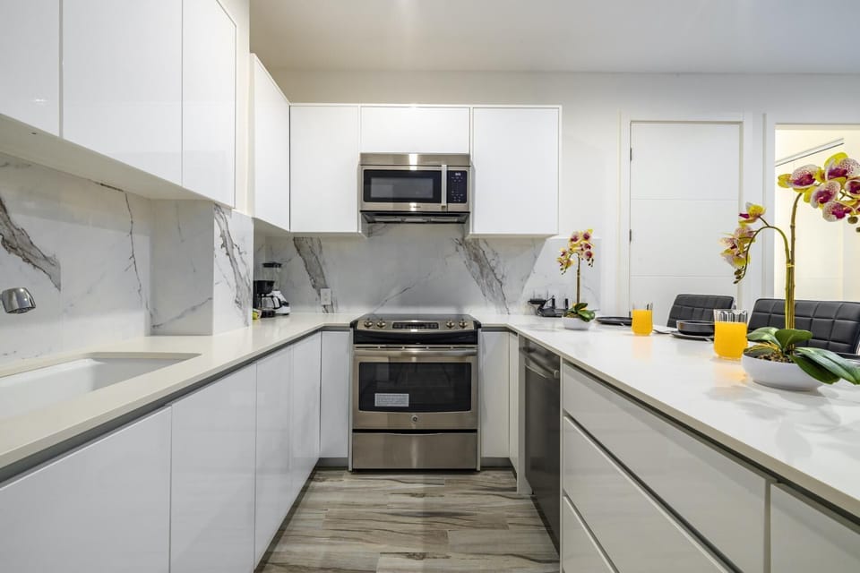 This modern kitchen/dining area brings joy into cooking and makes eating a pleasurable experience.