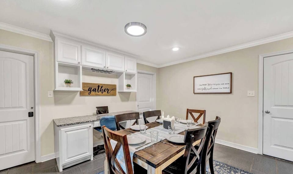 A table set for togetherness—this dining room blends comfort and charm. Share a family feast, work on a project, or enjoy a glass of wine in a space made for both celebration and everyday living. Separate work space  as well.