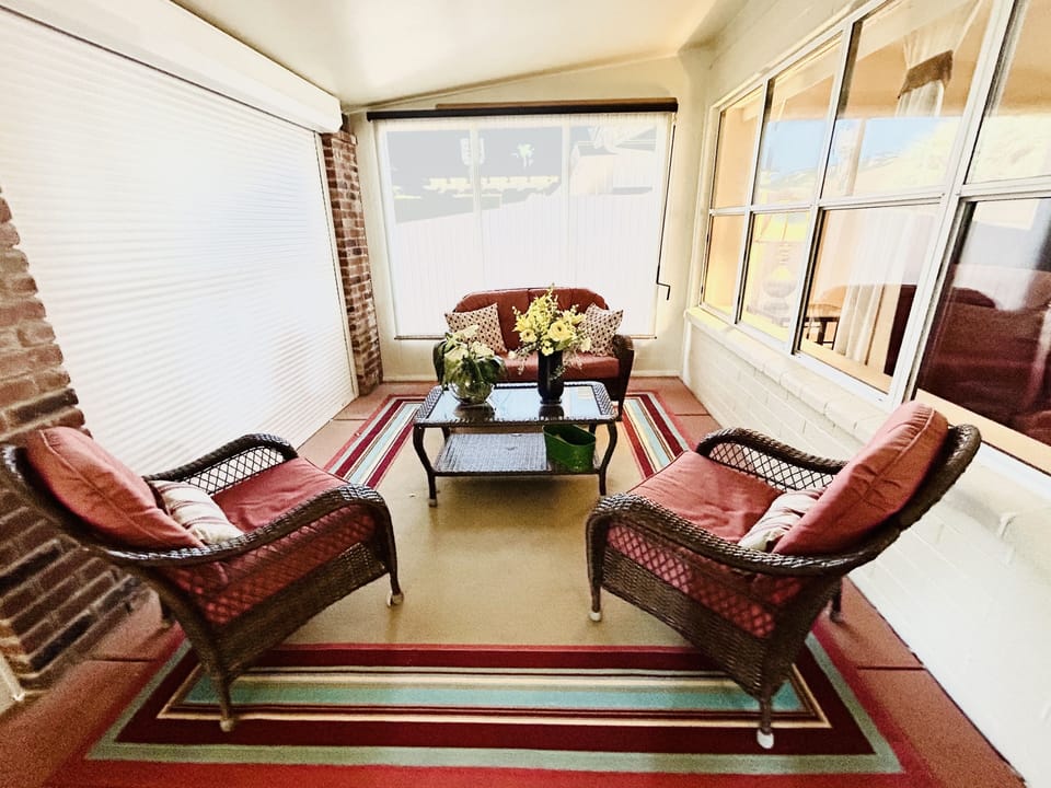 Enclosed Patio Room with Furniture