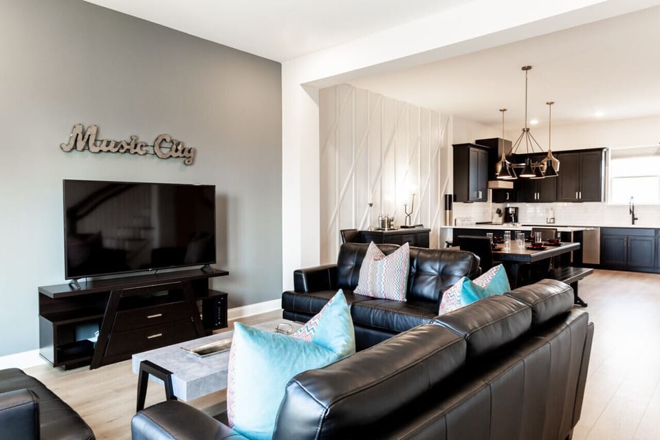 Open floor plan on the main floor with the kitchen, dining area, and living room.  TV with all the apps you could want.