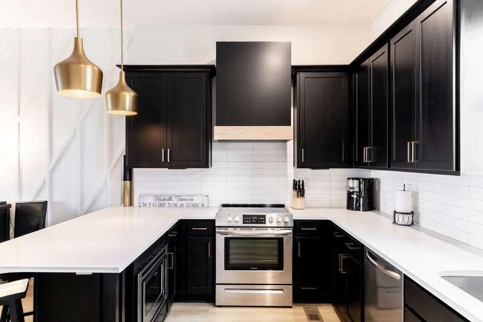 Bright, fully-equipped kitchen with seating for 4 at the counter plus a dining table with seating for 6. Opens up into the living room.