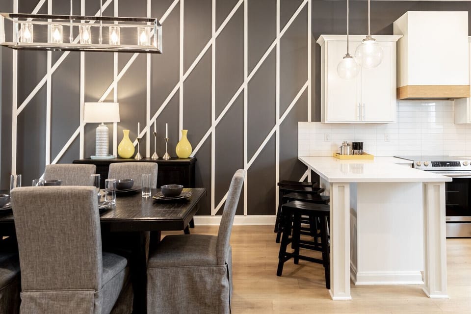Bright, fully-equipped kitchen with seating for 4 at the counter plus a dining table with seating for 6. Opens up into the living room.