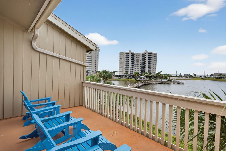 Settle into your private balcony with comfortable seating and enjoy peaceful water views perfect for morning coffee or evening relaxation.
