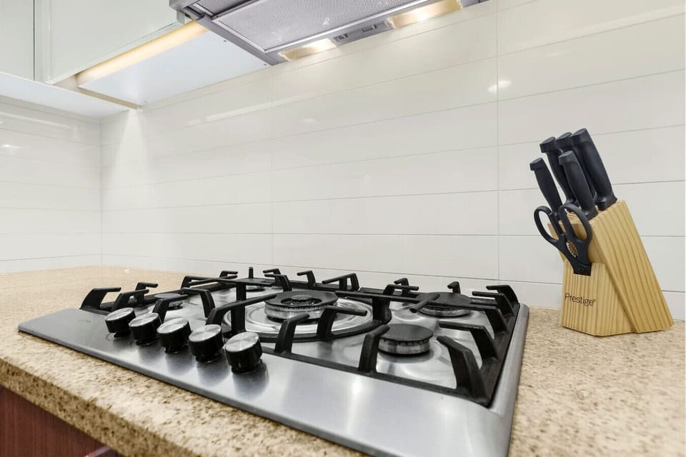 Gourmet Kitchen: Whip up culinary delights with modern appliances and sleek granite surfaces!