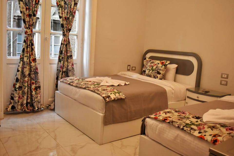 Quadruple Room, 2 Queen Beds | Minibar, free WiFi, bed sheets