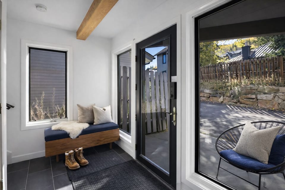 Nice mudroom and bench to take off your shoes, with chairs to sit outside.