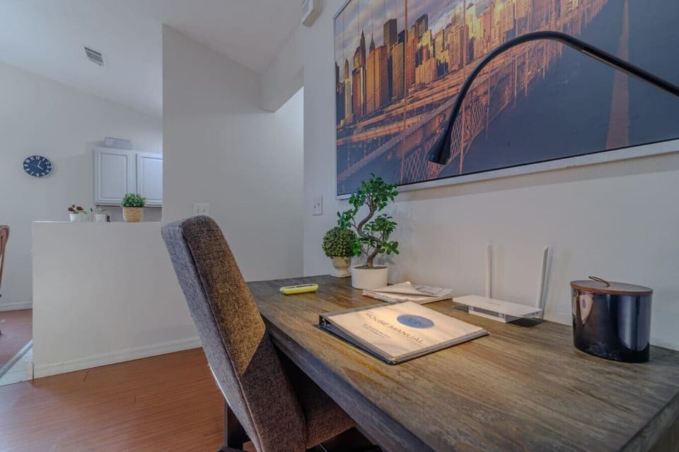 Office area with light. House manual on folder