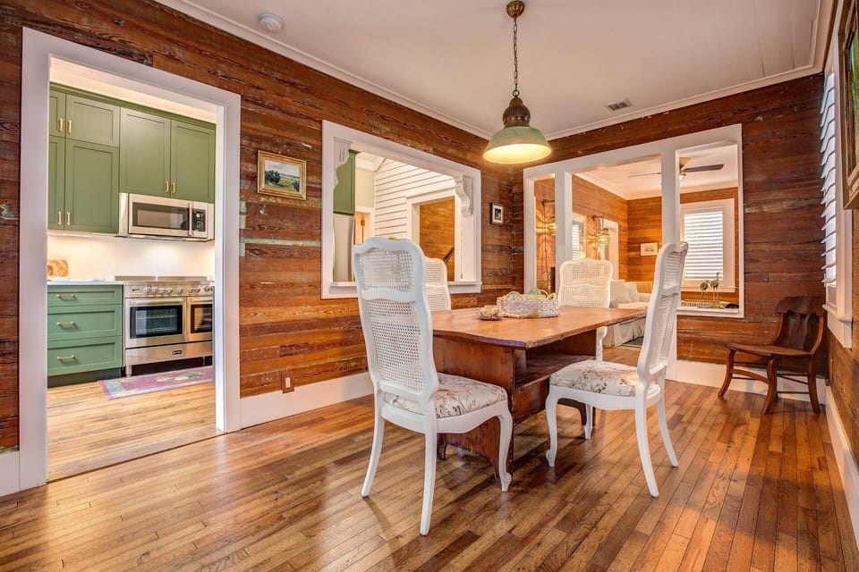 Savor the joy of family conversation as you prepare dinner in this open concept kitchen and dining area, where every moment becomes a treasured memory