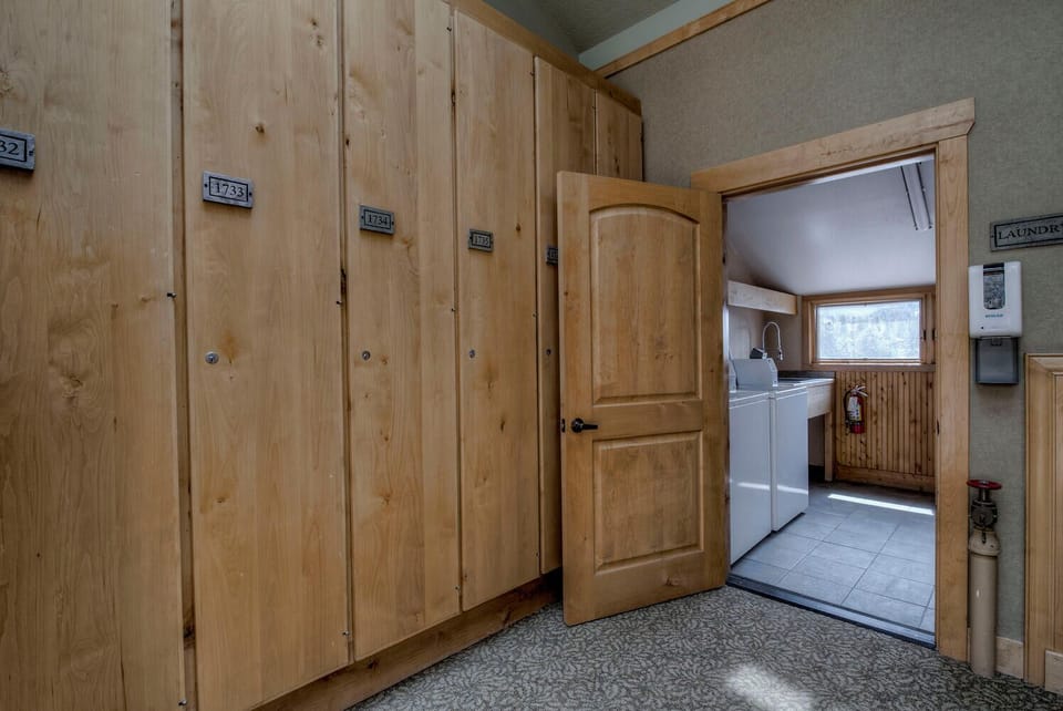 Store your gear safely in these spacious wooden lockers, with convenient laundry facilities just steps away for your comfort.