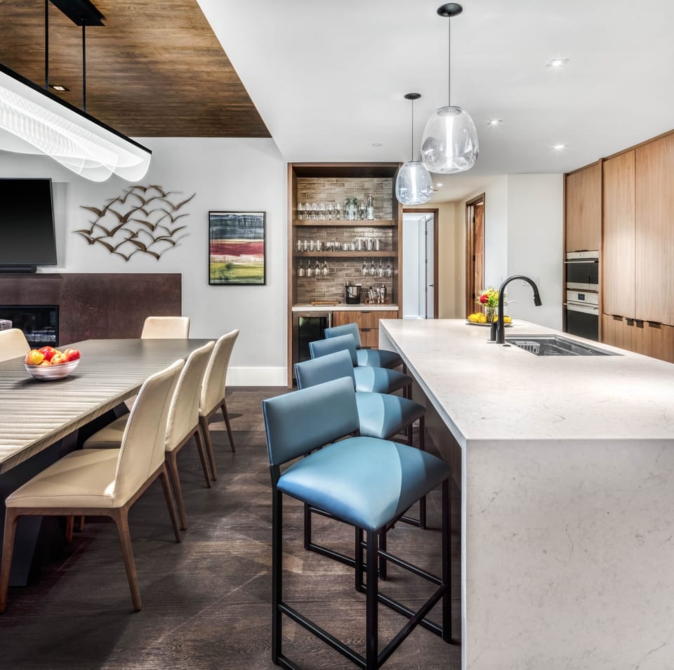 Open floorplan for spacious living across the kitchen, bar & dining areas