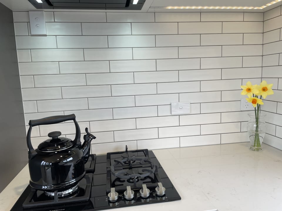 Whistling kettle and clean crisp subway tiles meet you in the morning