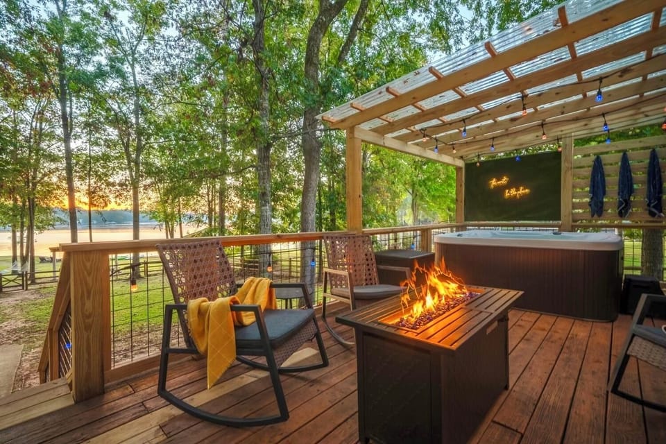 Serene lakefront views from the backdeck firepit and private covered sauna areas