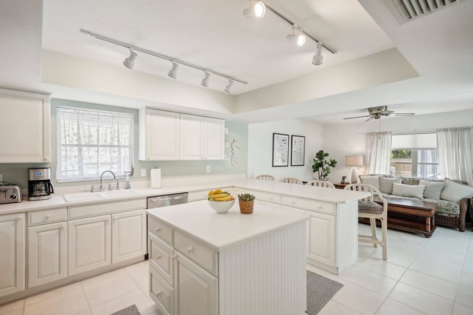 Open kitchen with counter seating for 4 to have conversation with the chef.