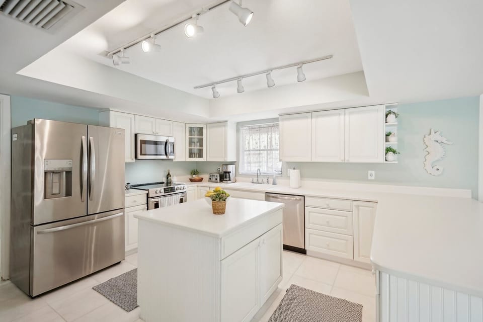 Big kitchen with center island for convenience.