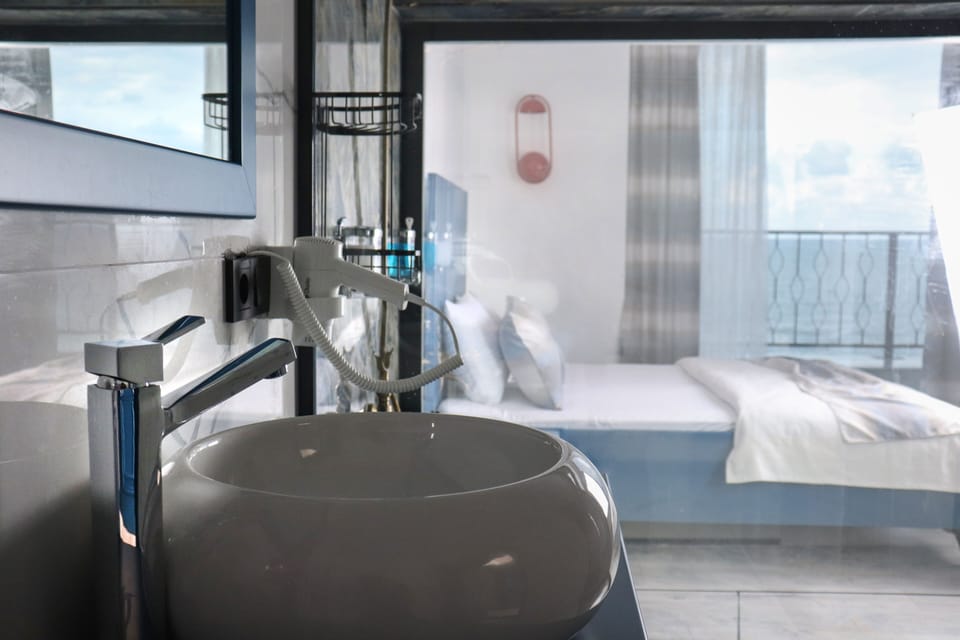 Luxury Room | Bathroom | Shower, rainfall showerhead, hair dryer, bathrobes