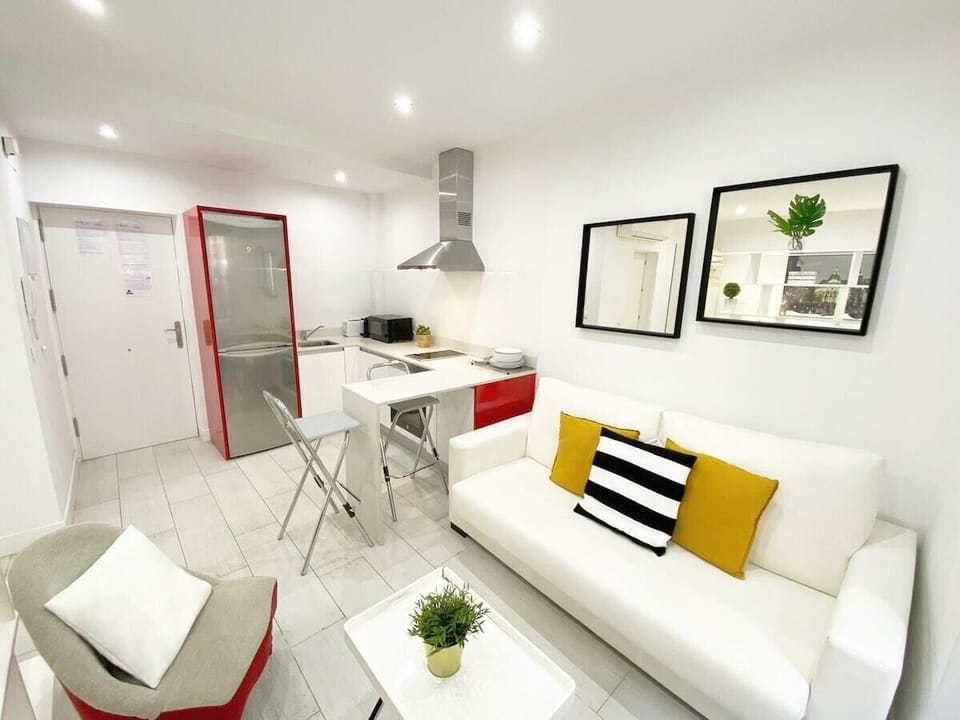 Views of the living room and part of the kitchen
