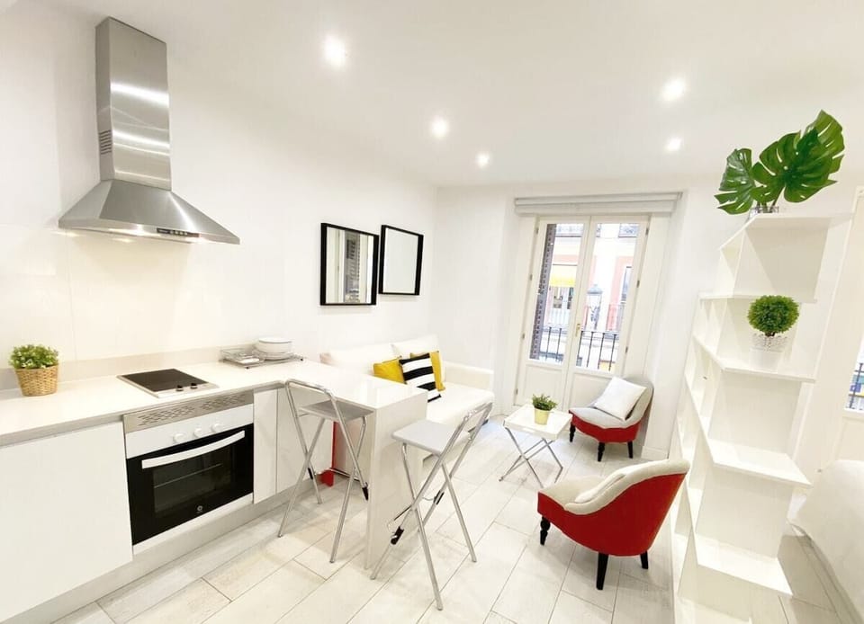 Close-up of kitchen - worktop with stools and living area