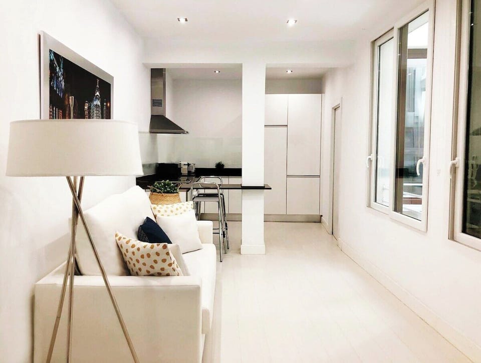 Views of the living room and part of the kitchen
