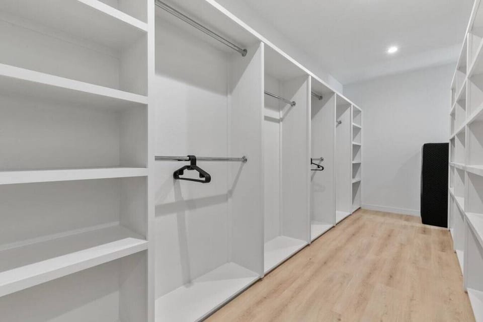Master bedroom closet with foldout mattress