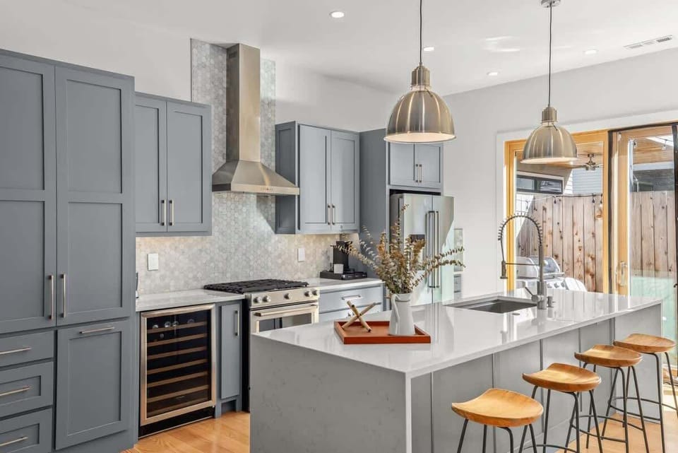 Cook like a pro in our chef’s kitchen—gas range, wine fridge, Keurig and island seating for 4.