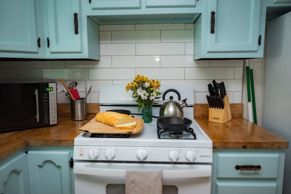 Whip up something special in our cheerful country kitchen- stocked and ready for your stay!