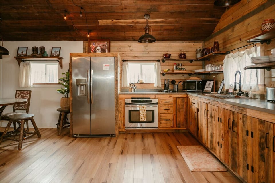 From coffee at sunrise to family dinners- this charming kitchen is ready for it all.