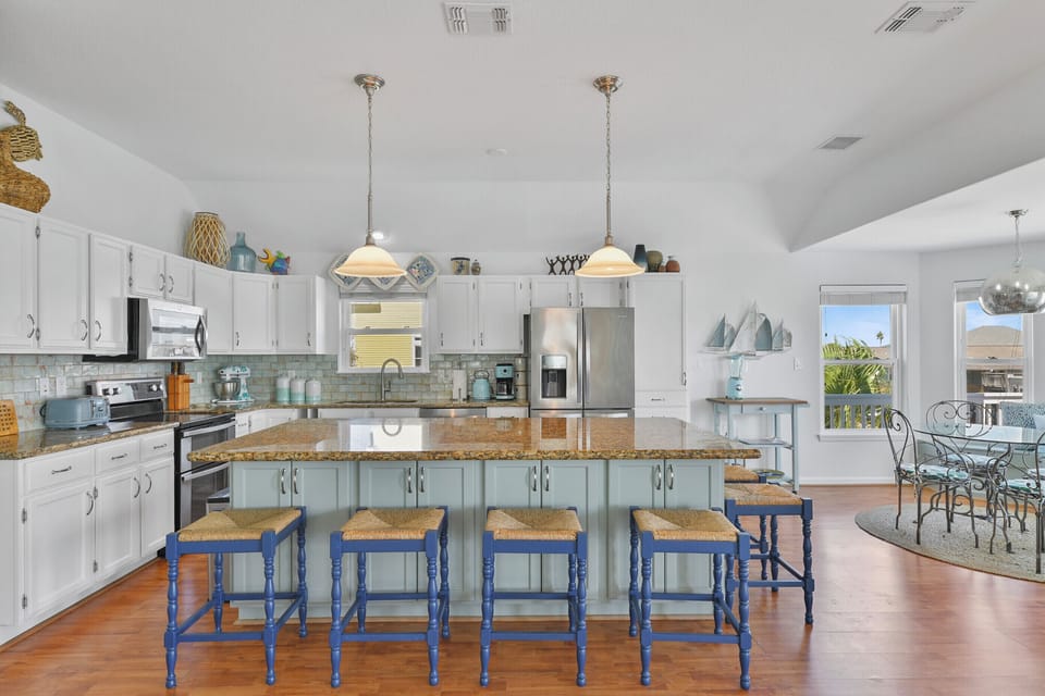 The kitchen with dining area to the right.