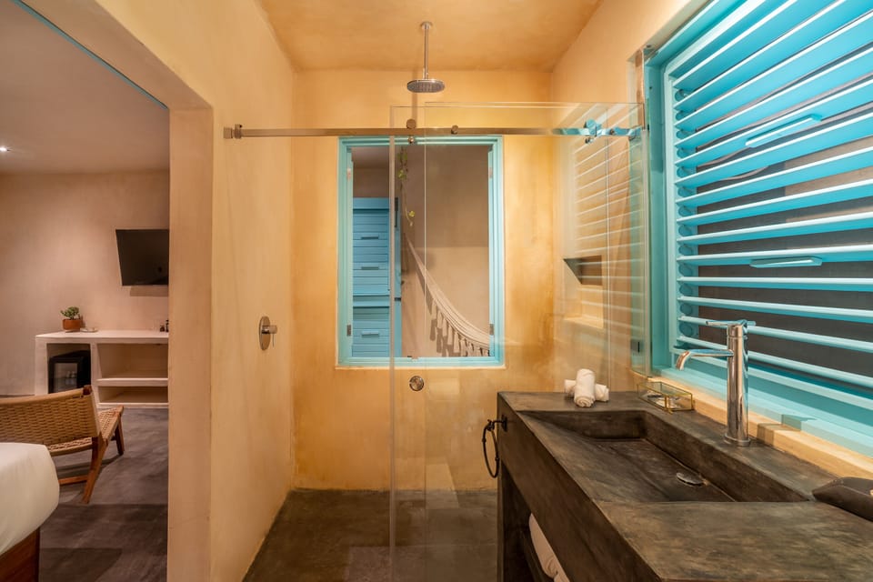 Shower, rainfall showerhead, designer toiletries, hair dryer