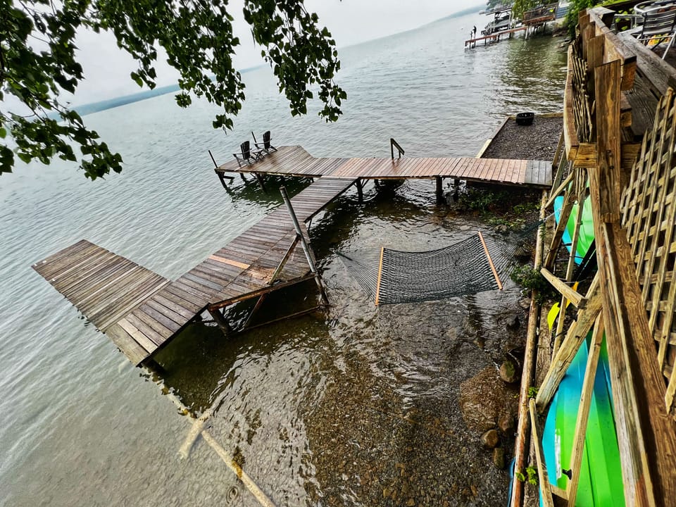 View of dock and deployable over-water hammock from deck. 