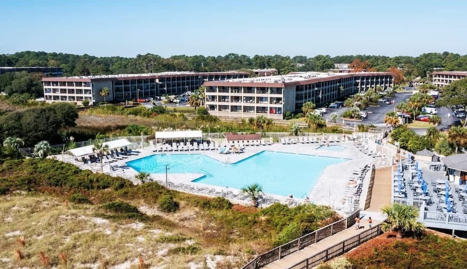 Take a dip in the massive sparkling blue swimming pool.