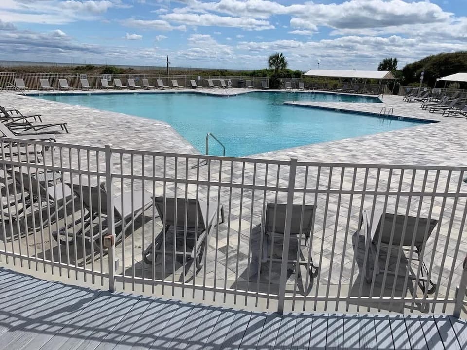 Plenty of lounge chairs and a secure gated area offer the perfect spot.