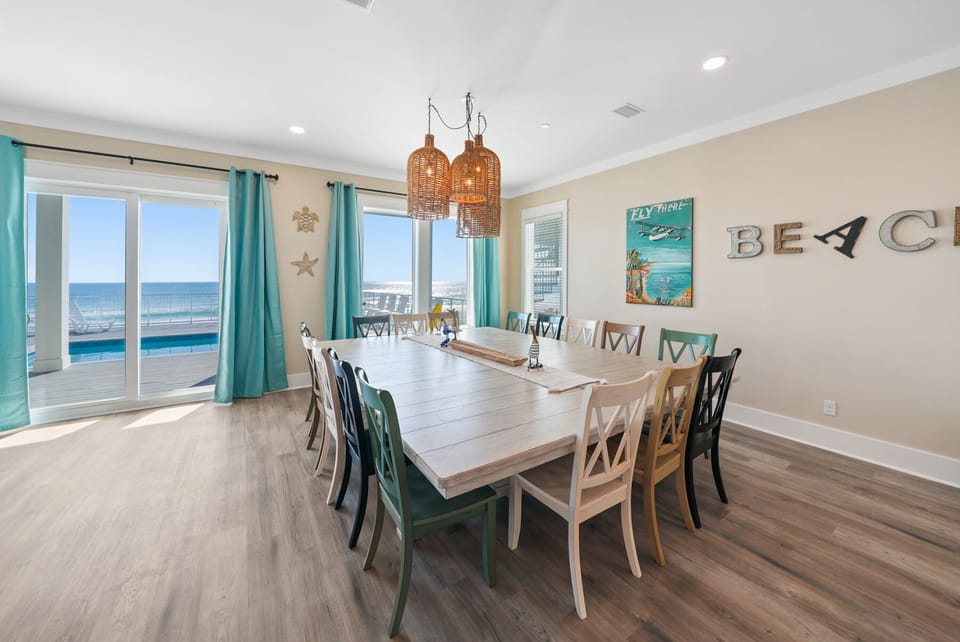 Gather your group around this spacious dining table with stunning ocean views streaming through your windows.