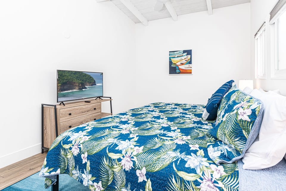 The second bedroom features a king bed and streaming TV.
                